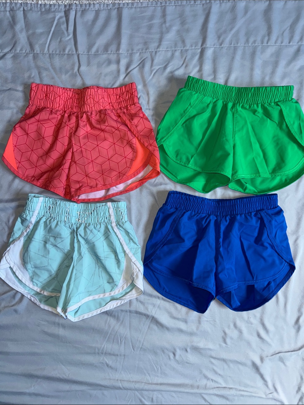 all in motion Girls' 4-Pack Active Shorts - Pink, Green, Light Blue & Royal Blue